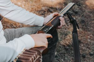 Country sportsman handling an over-and-under sporting shotgun